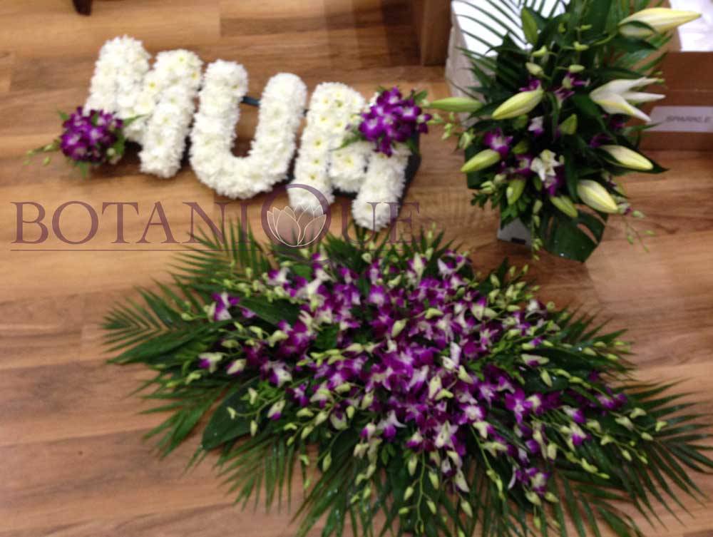Mum funeral flowers with casket flowers